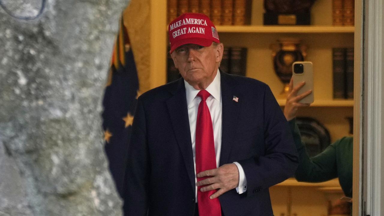 President Donald Trump walks from the Oval Office