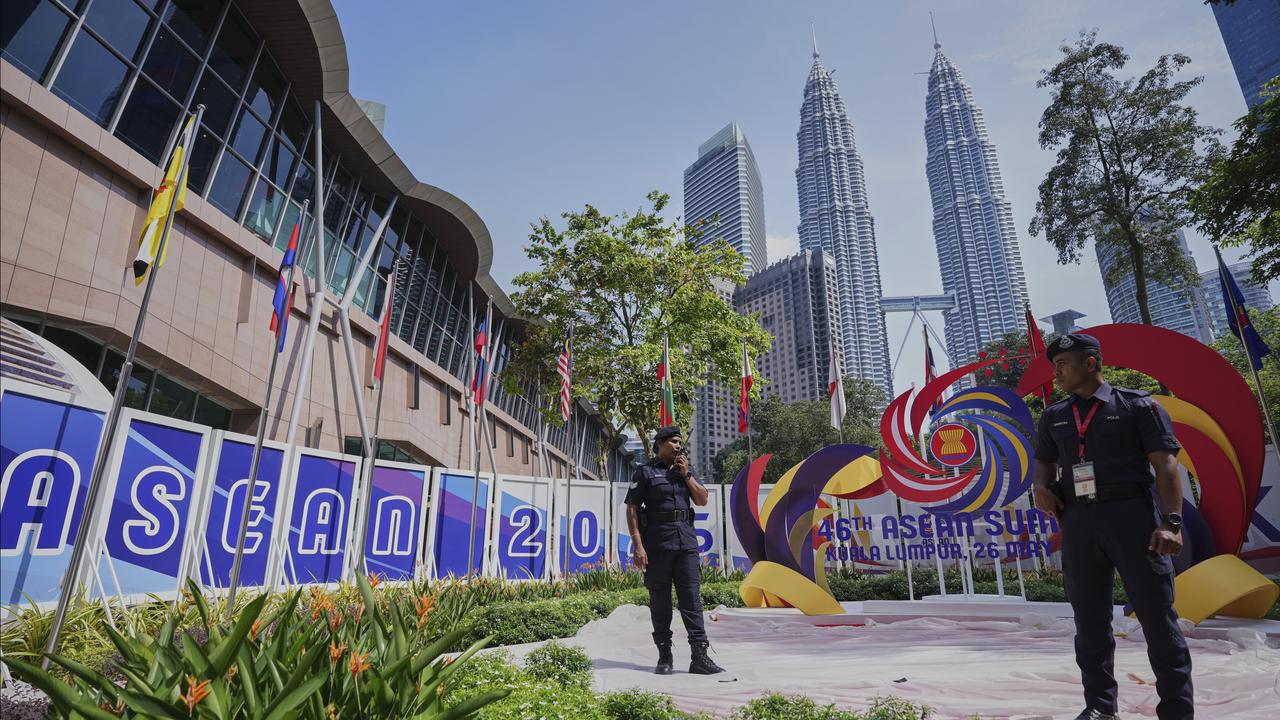 Malaysian Police stand guard outside the venue for ASEAN