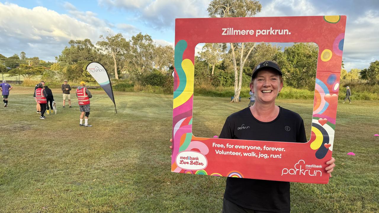 Kate Corner poses inside an event photo frame