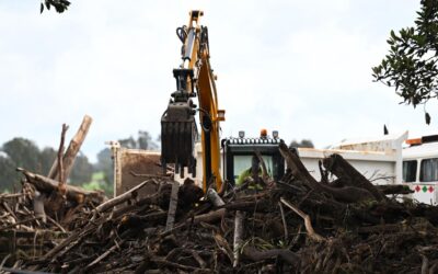 Locals, volunteers dig in as flooded towns fight back