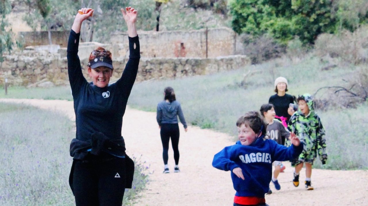 Kate Corner does warmup jumps with son Lachlan