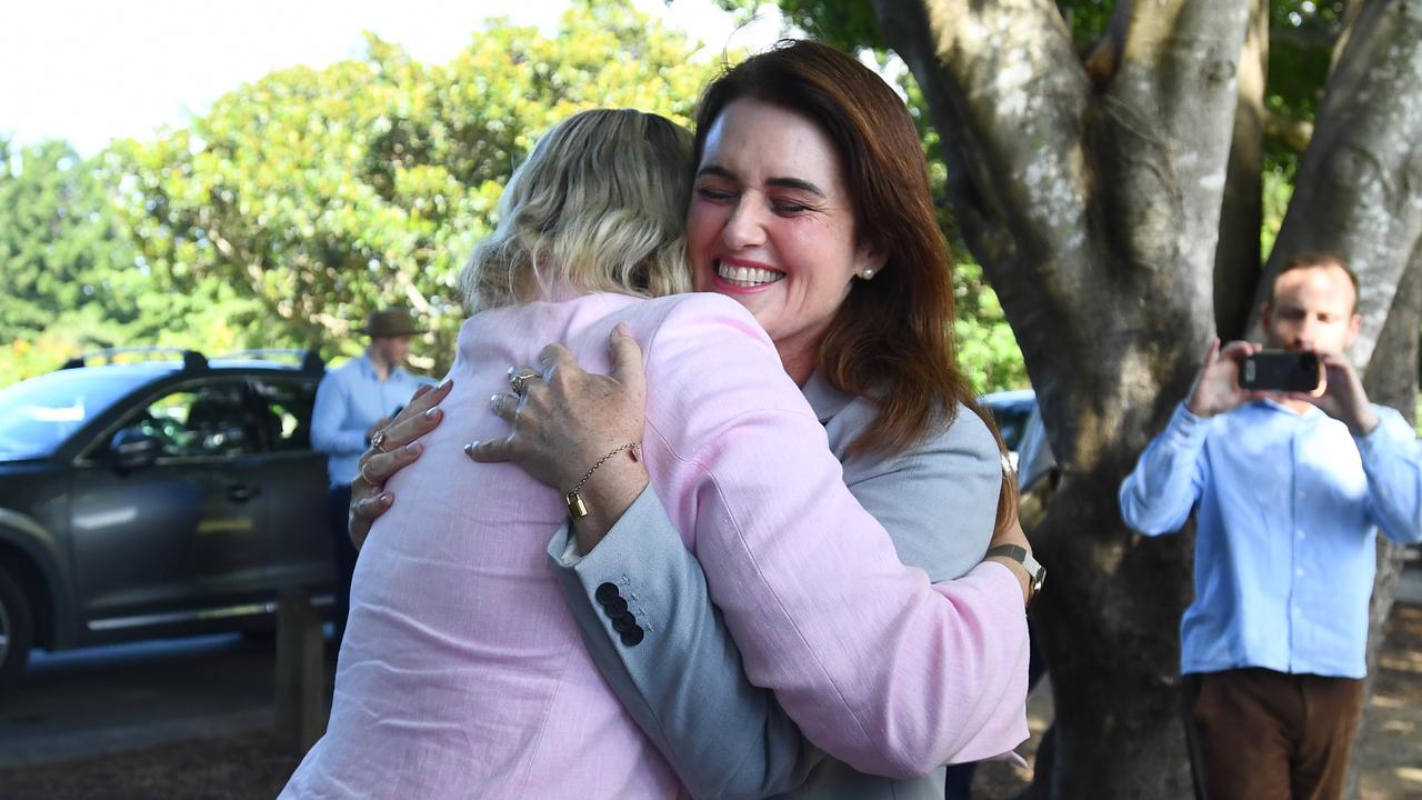 Kara Cook (left) and Ali France embrace
