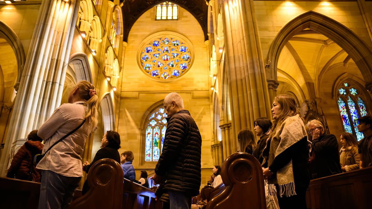 People pray at St Mary's Cathedral in Sydney