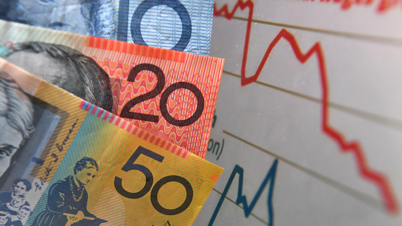 Australian currency is seen next to a graph