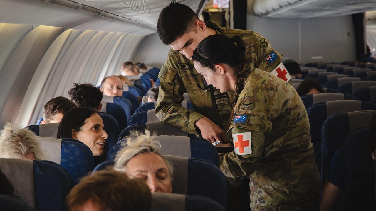ADF personnel providing assistance to Australians on a RAAF KC-30A