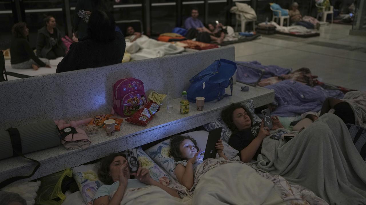 People shelter in an underground station