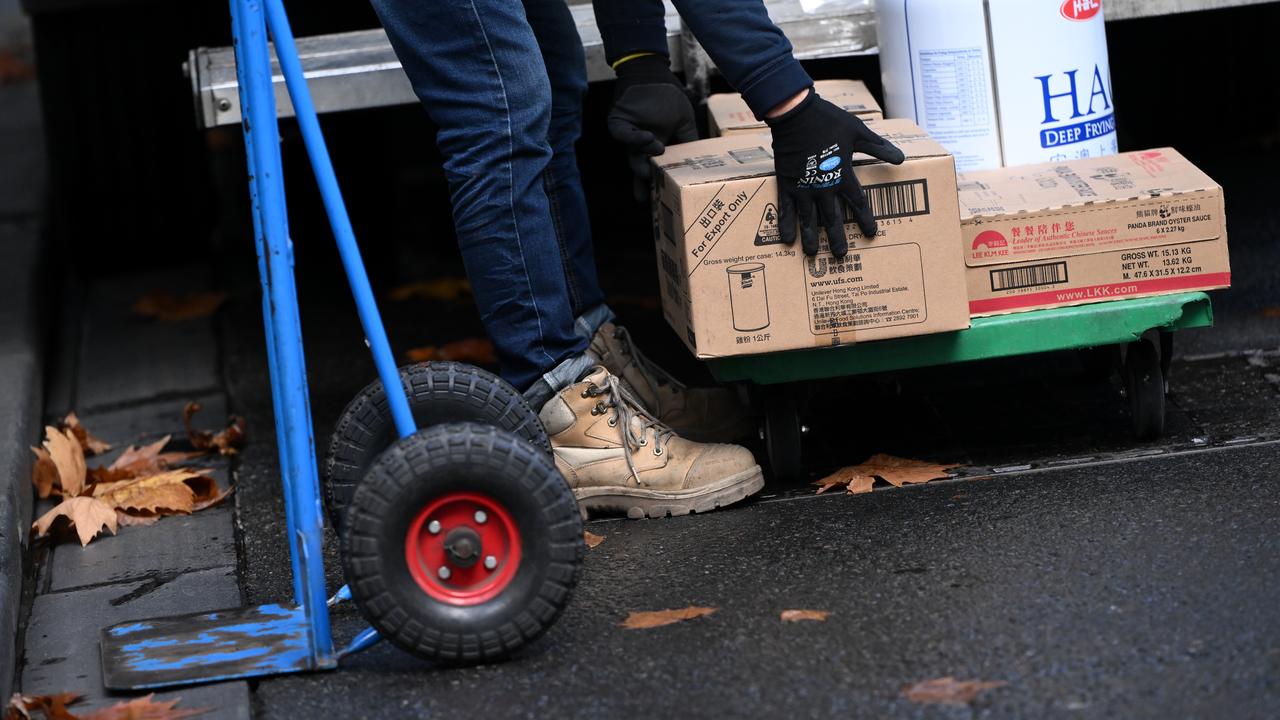 A delivery worker moving boxes
