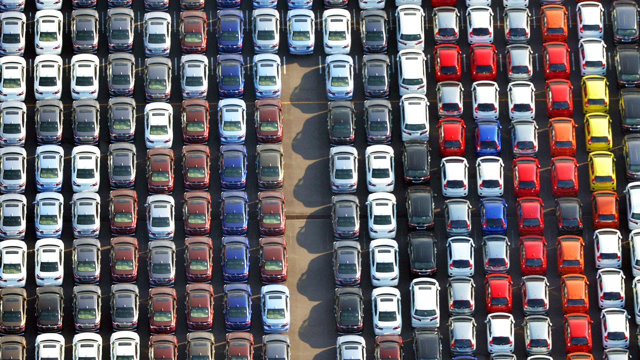 cars are parked waiting to be exported at Yokohama port near Tokyo