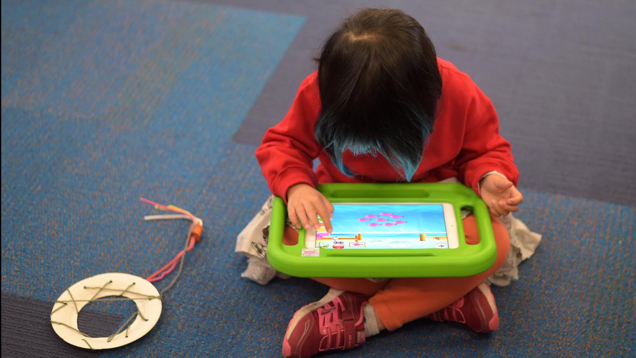 Girl plays on iPad