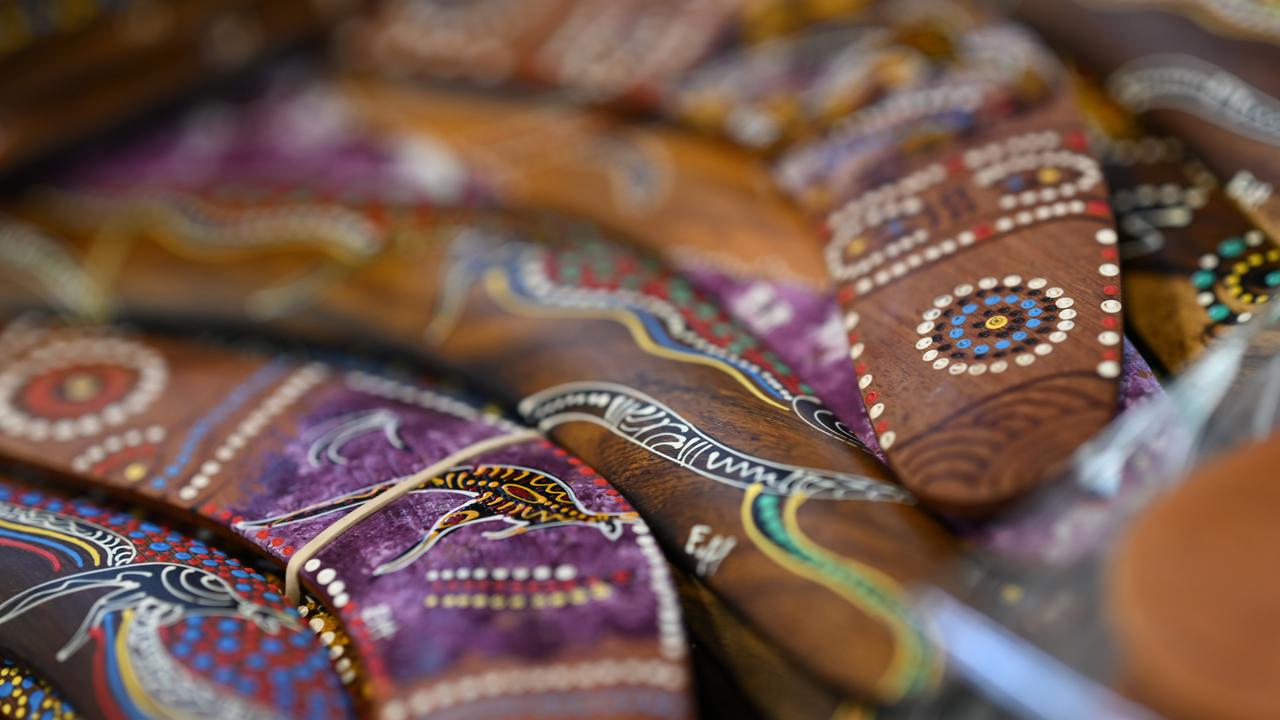 Souvenir boomerangs on display at a market