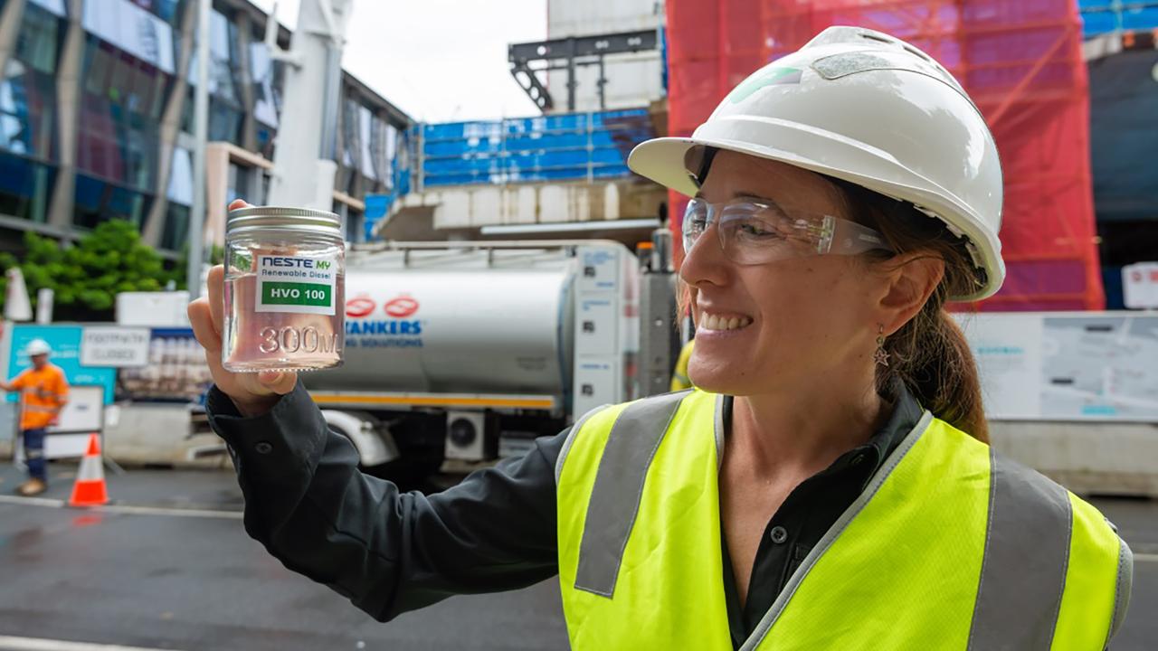 Lendlease's Abigail Heywood holding a cannister of renewable diesel