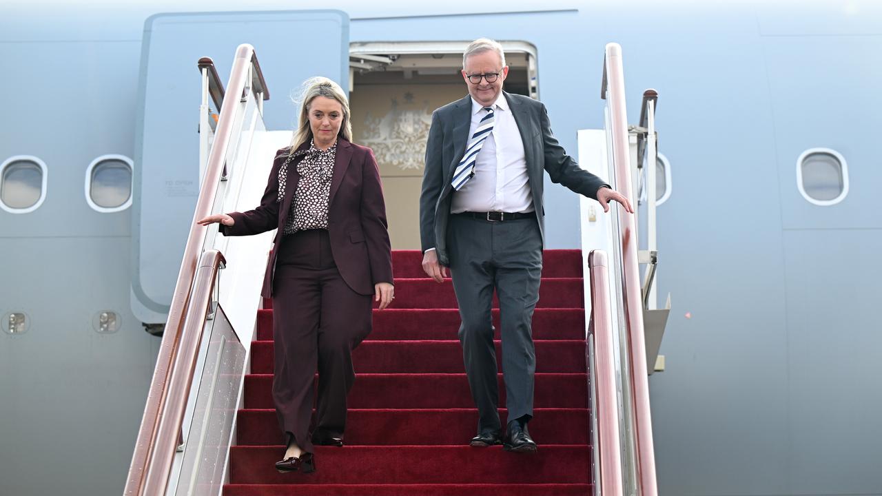 Anthony Albanese arrives with partner Jodie Haydon