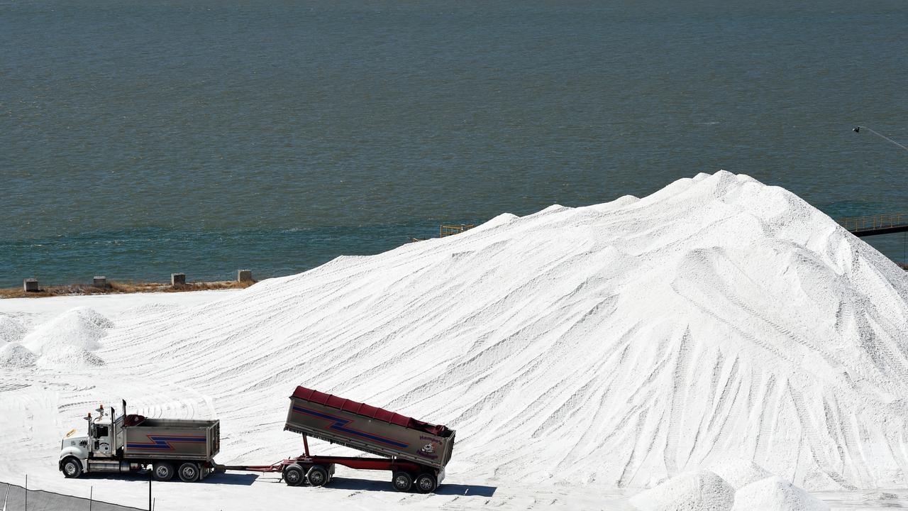 A truck offloads magnesite
