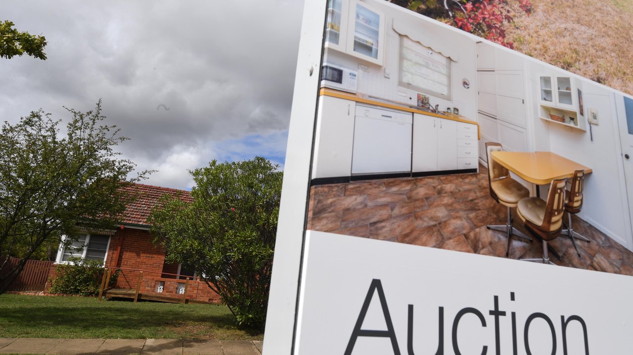 Real estate advertising board is seen in Canberra