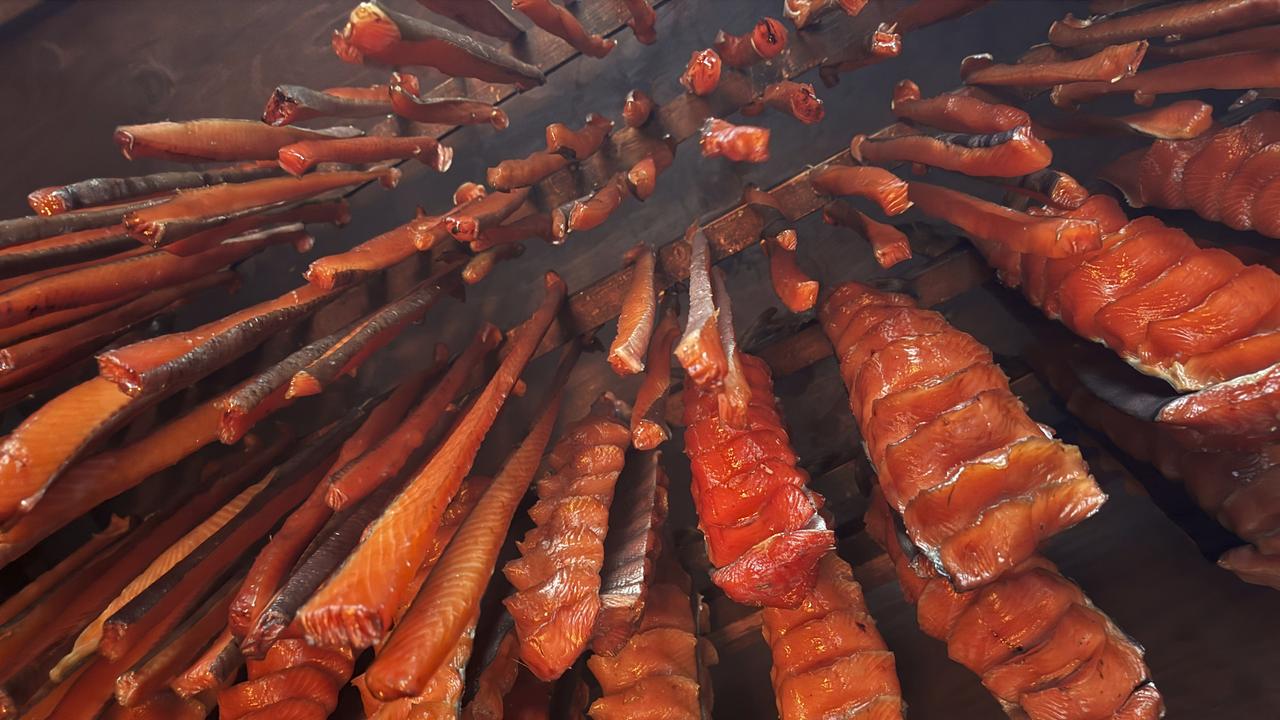 Salmon strips hanging in a smokehouse