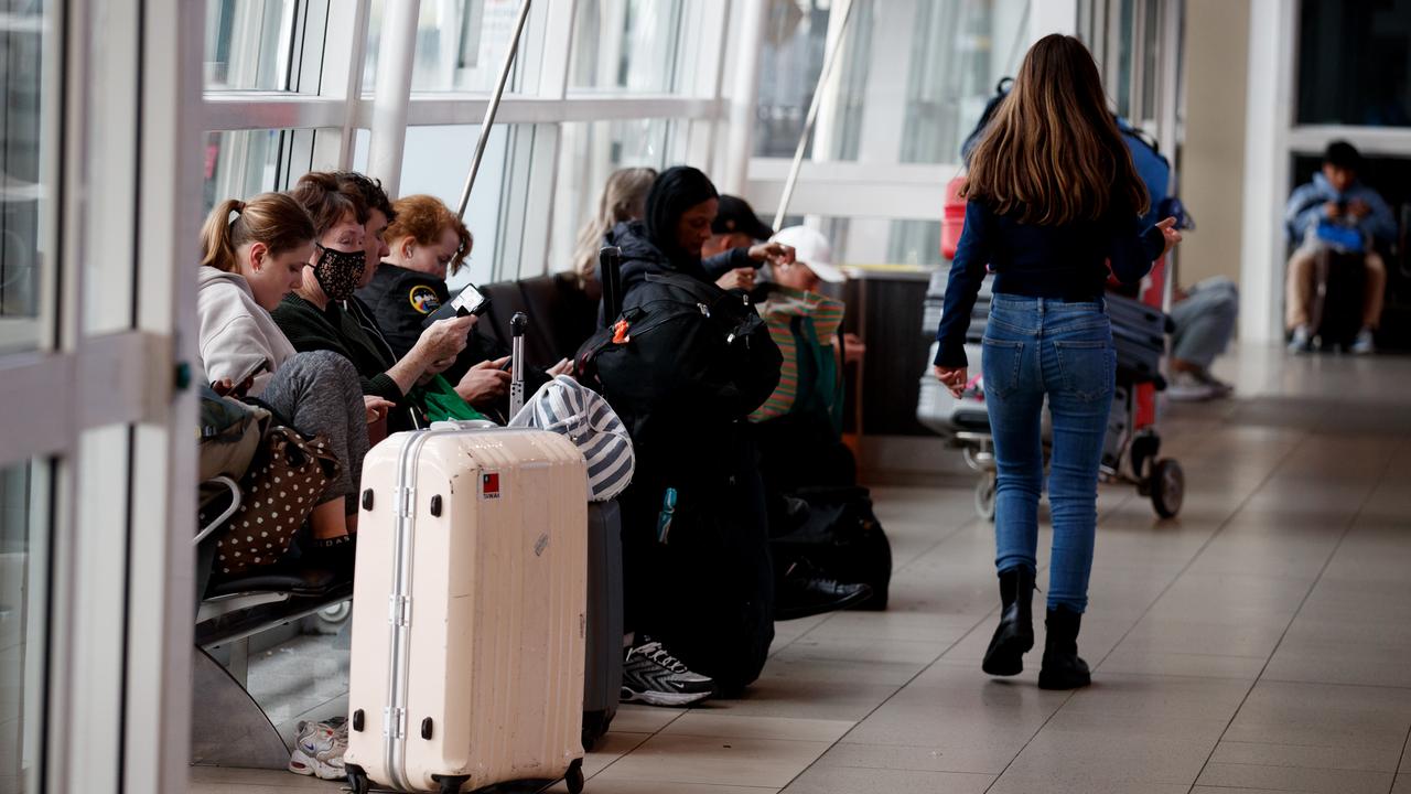 People wait at Sydney Airport (file image)