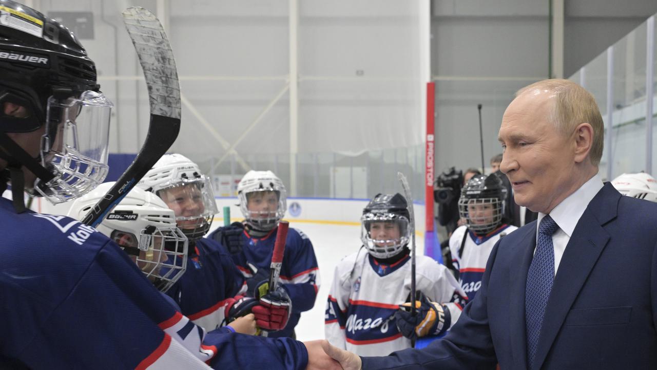 Putin with ice hockey players
