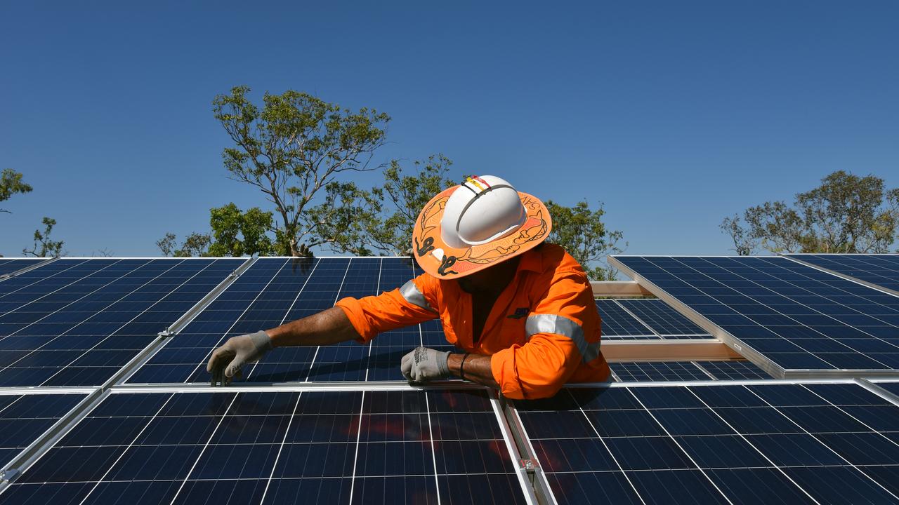 Northern Territory workers install solar panels in Daly River