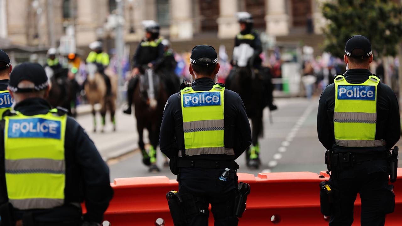 Police during a National Day of Action rally in Melbourne