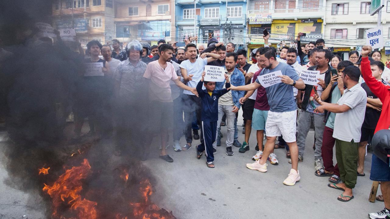 Protesters burn tires violating the curfew orders in Kathmandu, Nepal