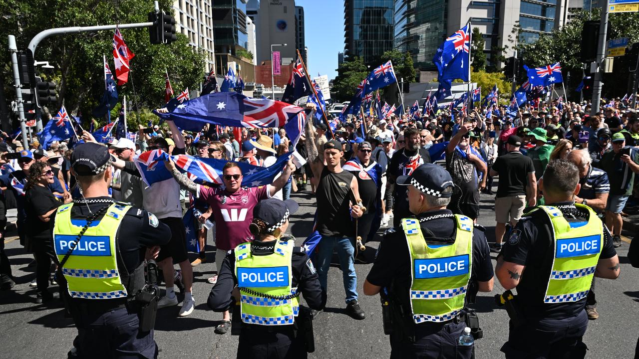 Police separating anti-immigration protesters and Pro-immigration