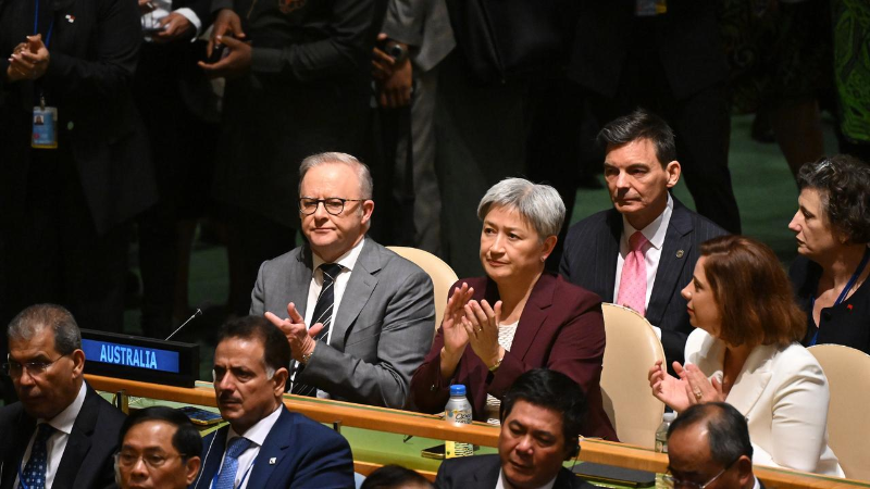 Albo and Wong applauding