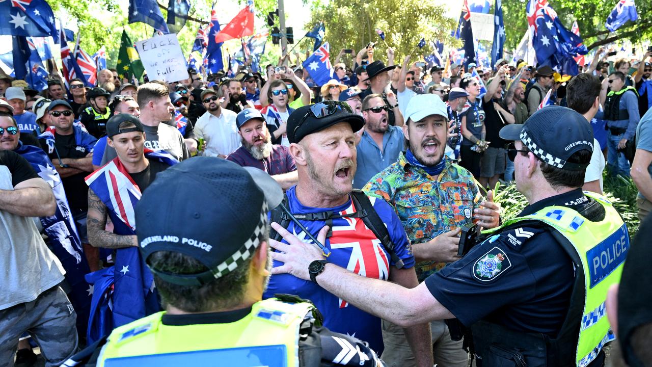 Police are seen separating protesters in Brisbane