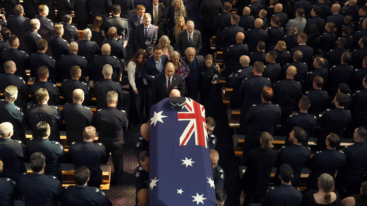 Family members at  Police officer Vadim De Waart-Hottart's funeral