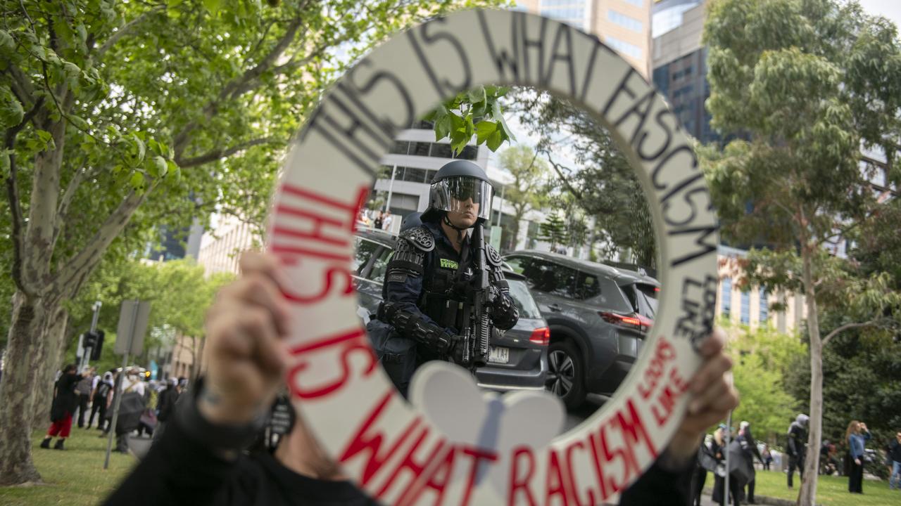 A protester with a sign supporting immigration