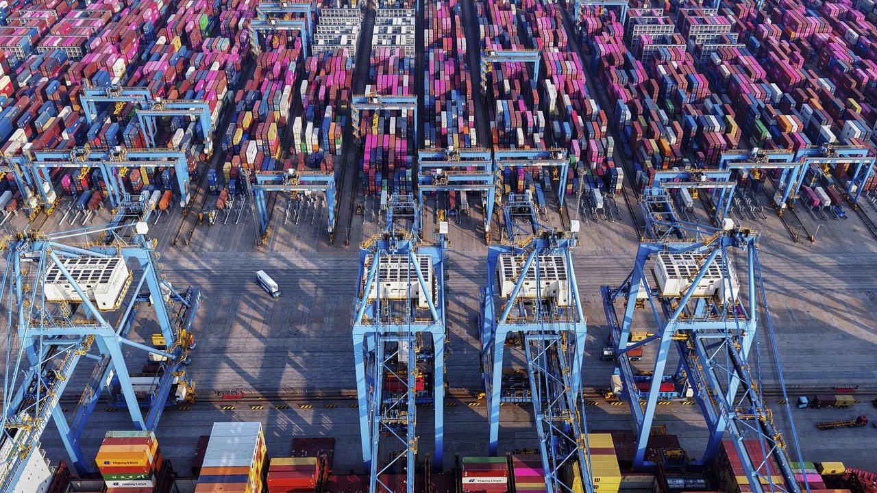 A vessel loading containers at a container terminal, in east China