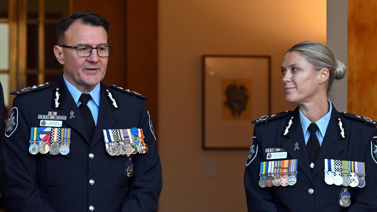 Outgoing AFP chief Reece Kershaw and new commissioner Krissy Barrett