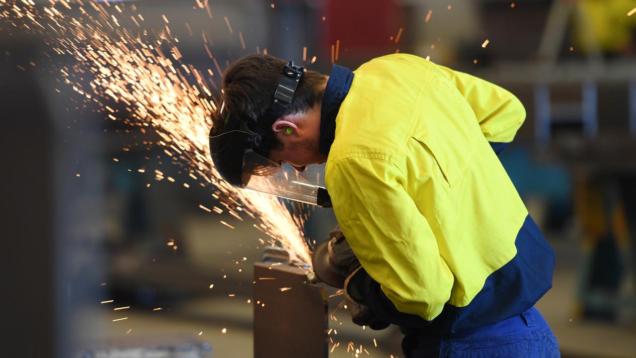 A worker is seen on the production floor at an engineering plant