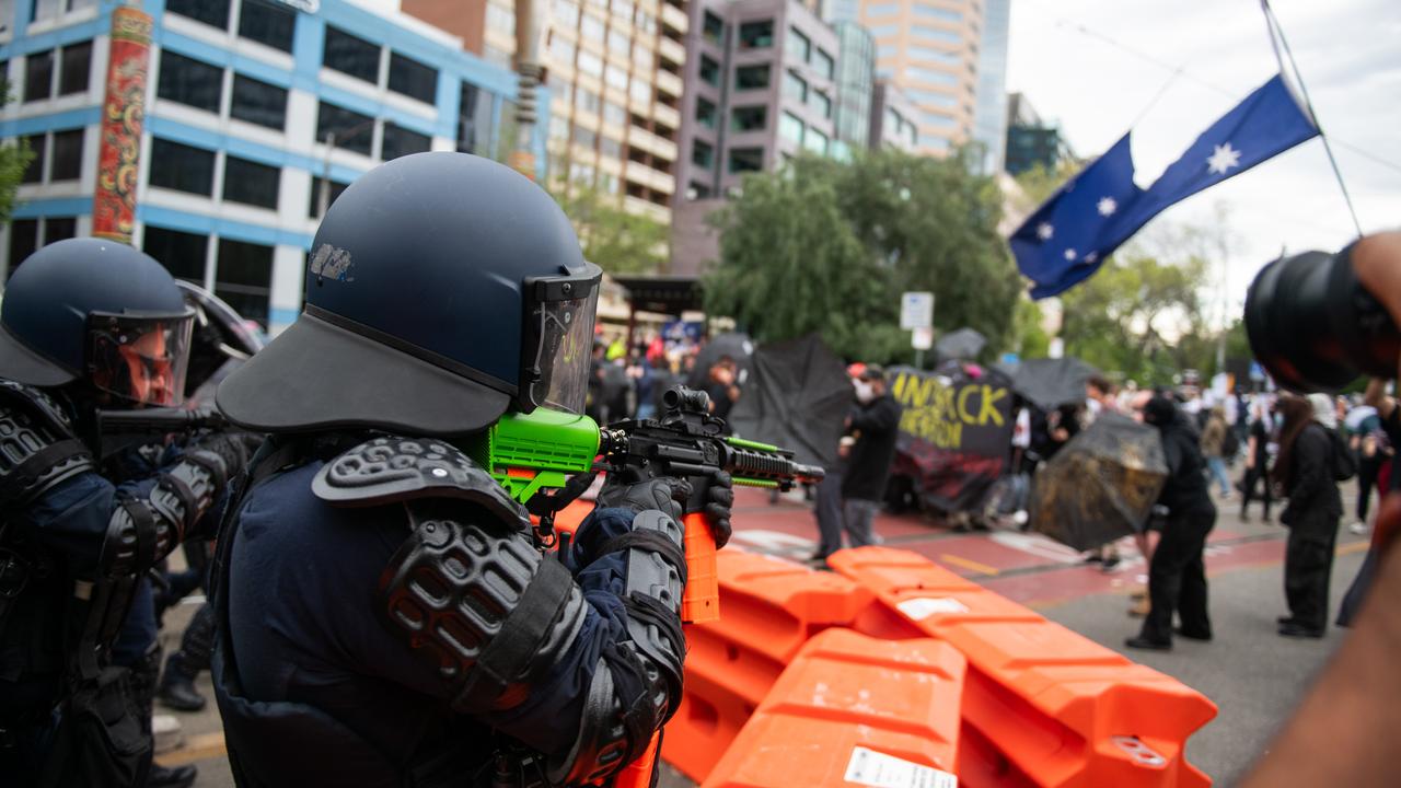 Protesters and riot police facing off in Melbourne