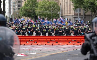 Police cop rocks, bottles as migration protesters clash