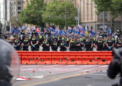 Police cop rocks, bottles as migration protesters clash