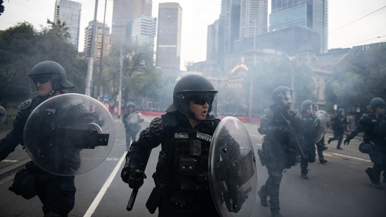 Riot police trying to control the two protest groups