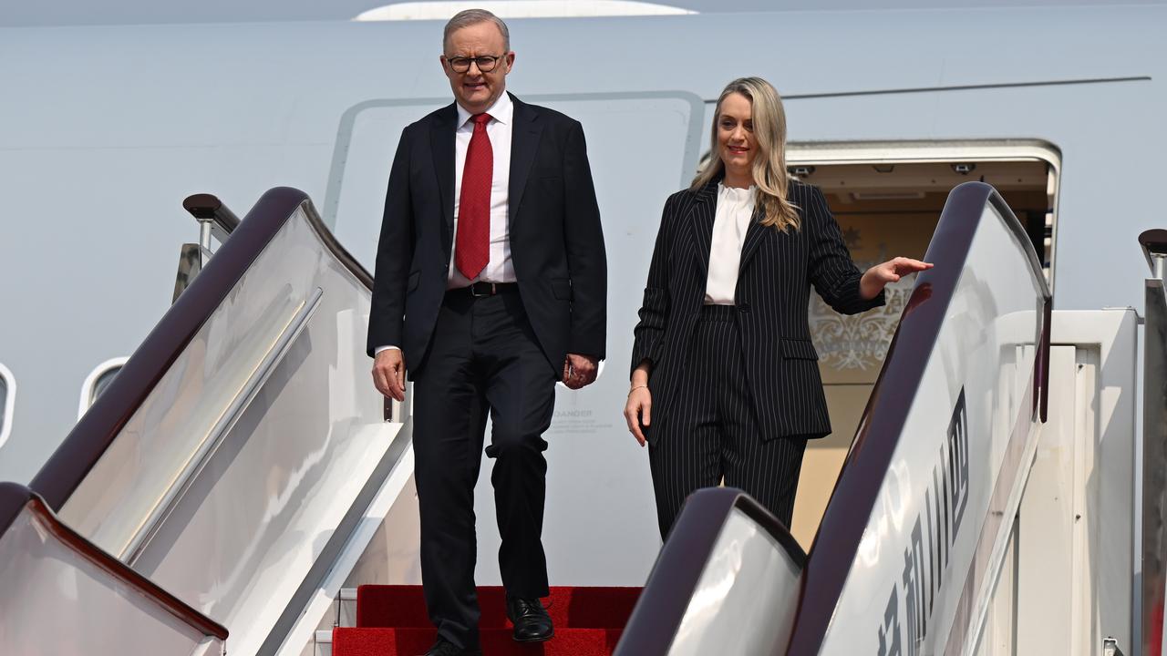 Anthony Albanese and Jodie Haydon deplane