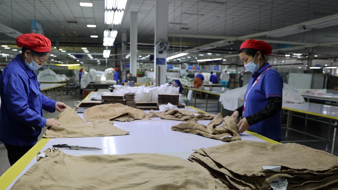 Workers labor at a textile manufacturer