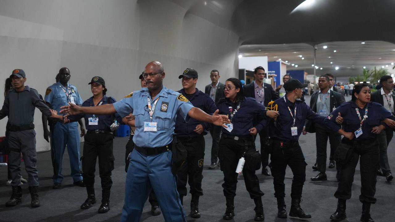 Security personnel form a chain