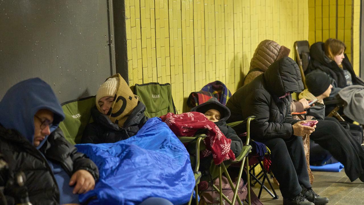 People seeking refuge in an underground pedestrian crossing in Kyiv