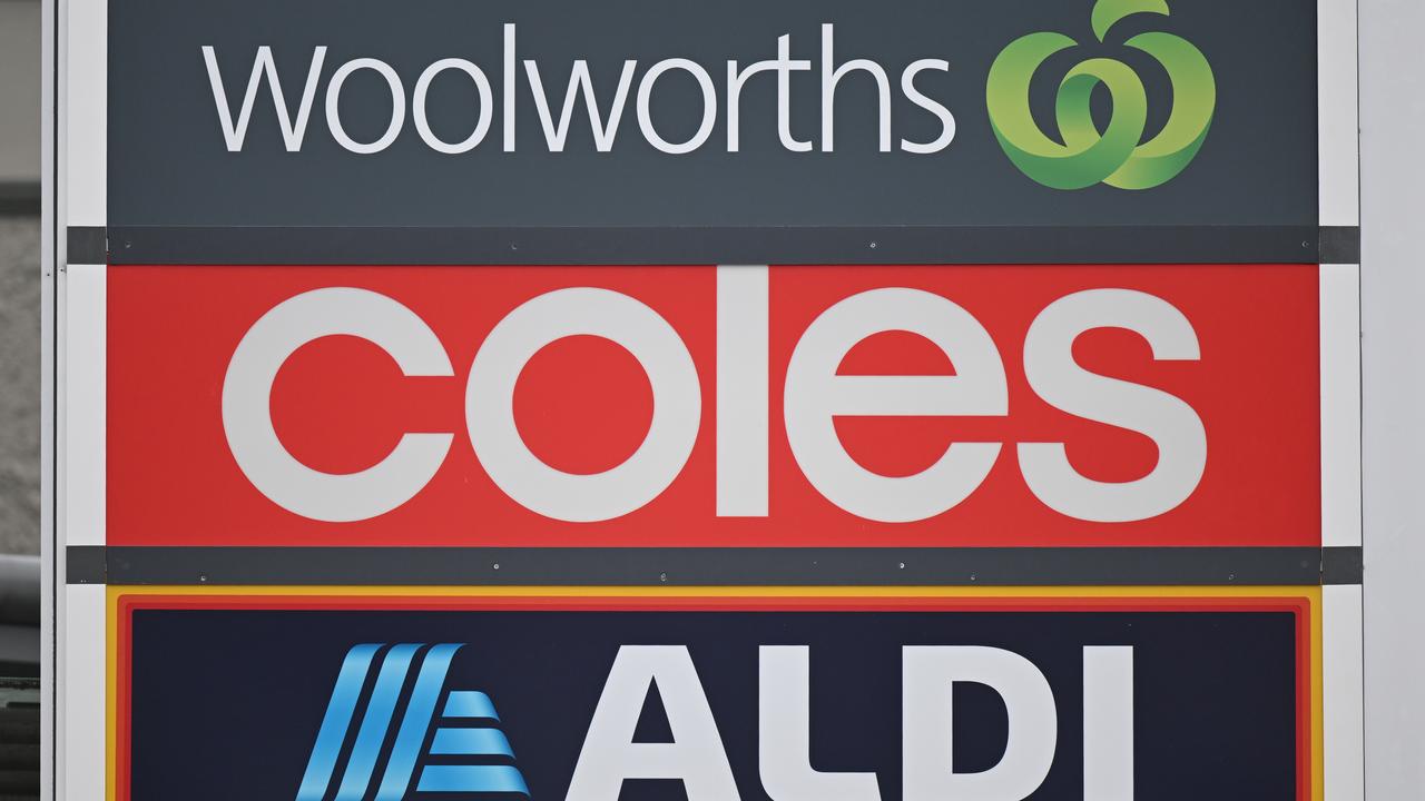 Signs and logos of Woolworths, Coles and Aldi
