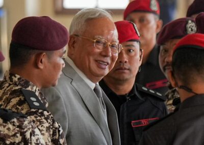 Former Malaysian PM convicted in corruption trial