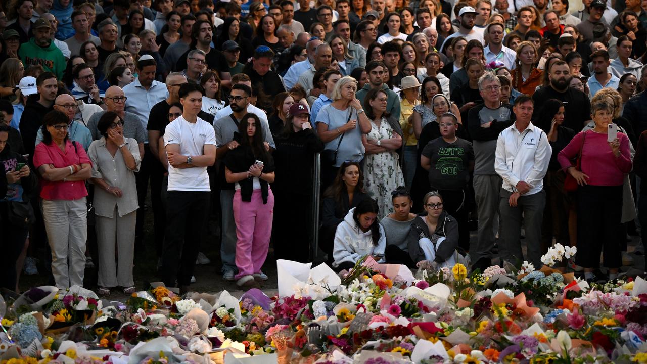 Mourners attend a vigil at a memorial in Bondi Beach