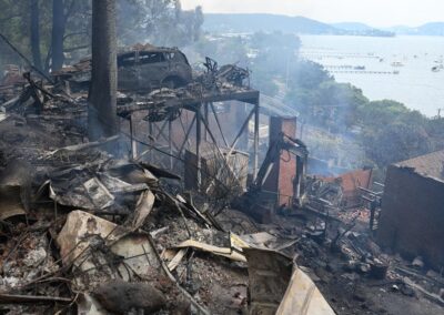 Wind change heightens fire risk as a dozen homes lost