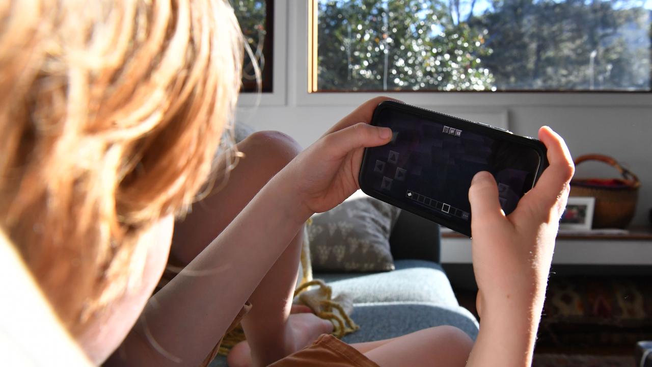 A young person plays on a mobile phone (file image)