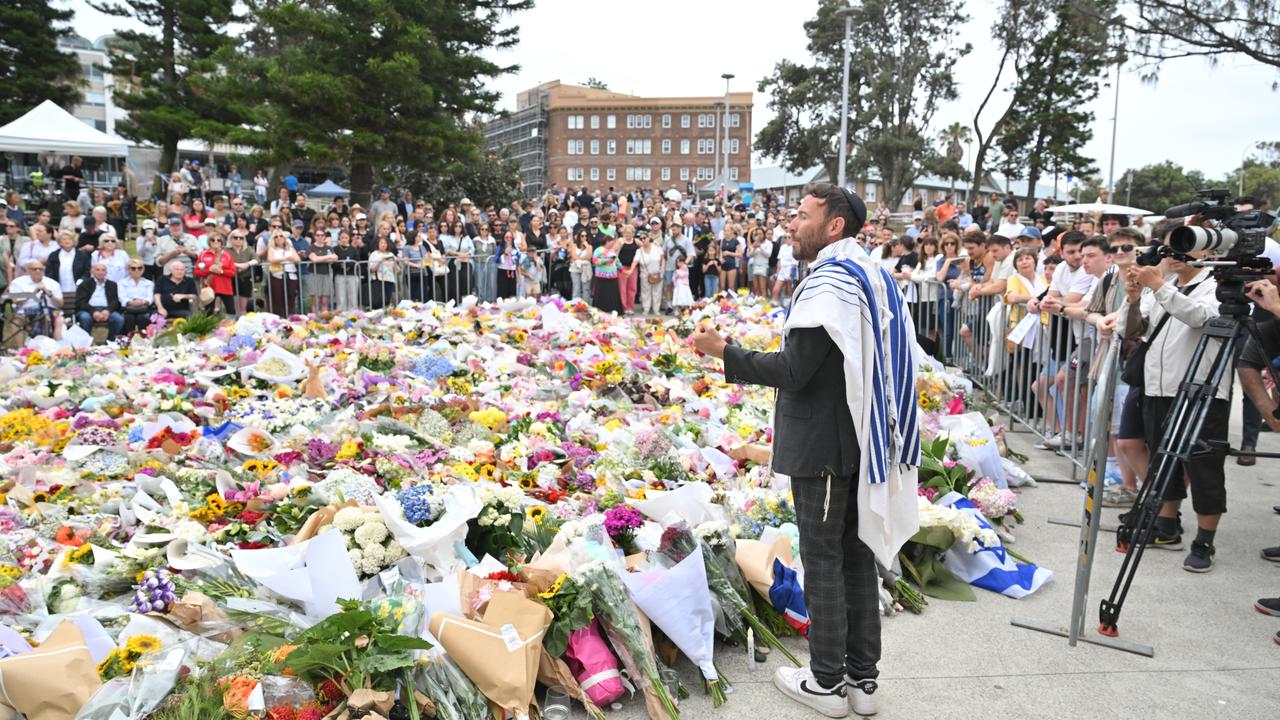 A rabbi addresses mourners at a memorial at Bondi Beach in Sydney