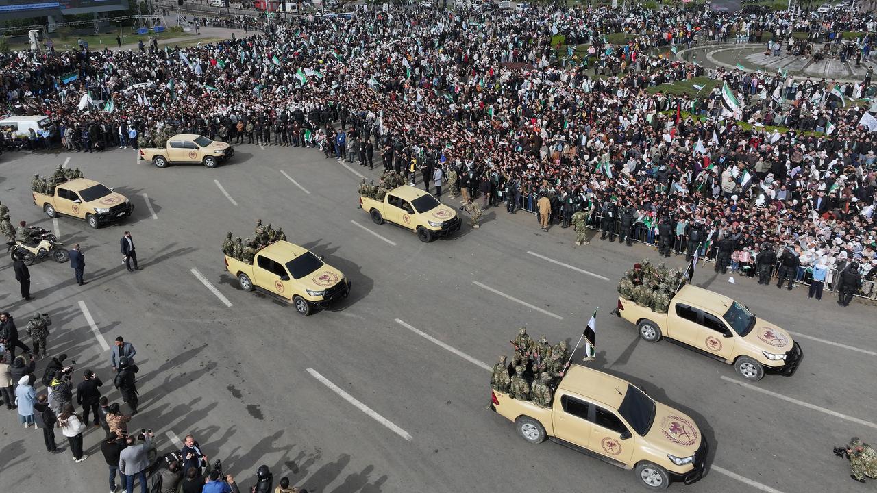Soldiers in utes in the parade