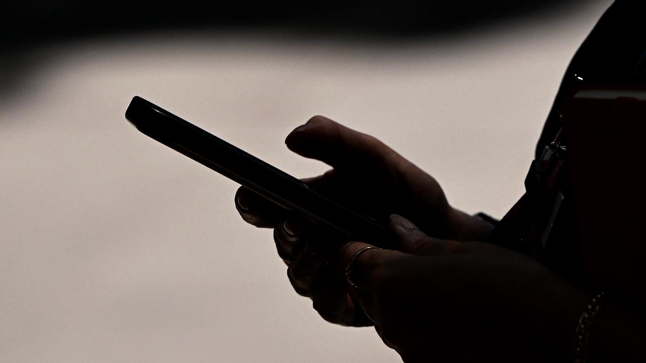 A woman uses a smartphone device