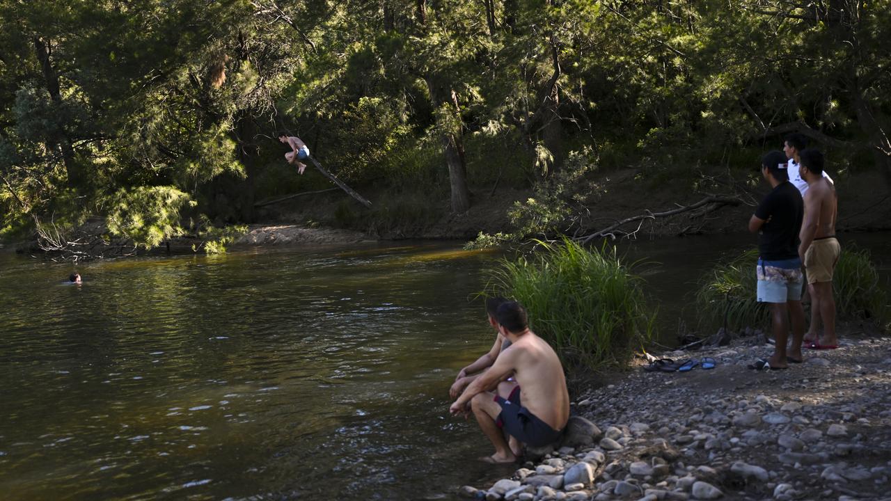 A man jumps into the water at Cotter Bend near Canberra (file image)