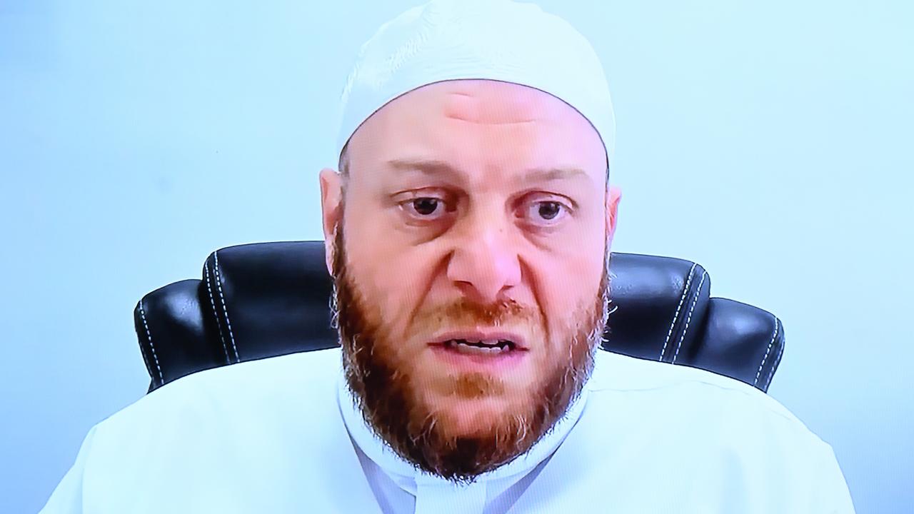 Imam Shadi Alsuleiman via videolink at a parliamentary inquiry